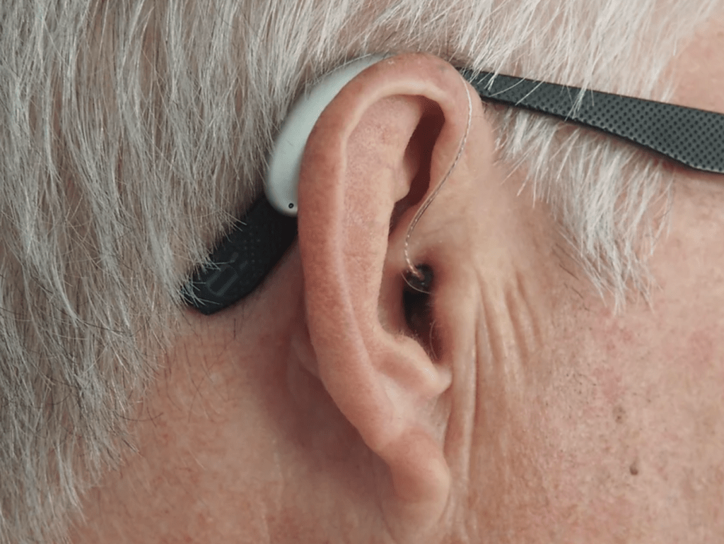 Close-up of a hearing aid on an ear